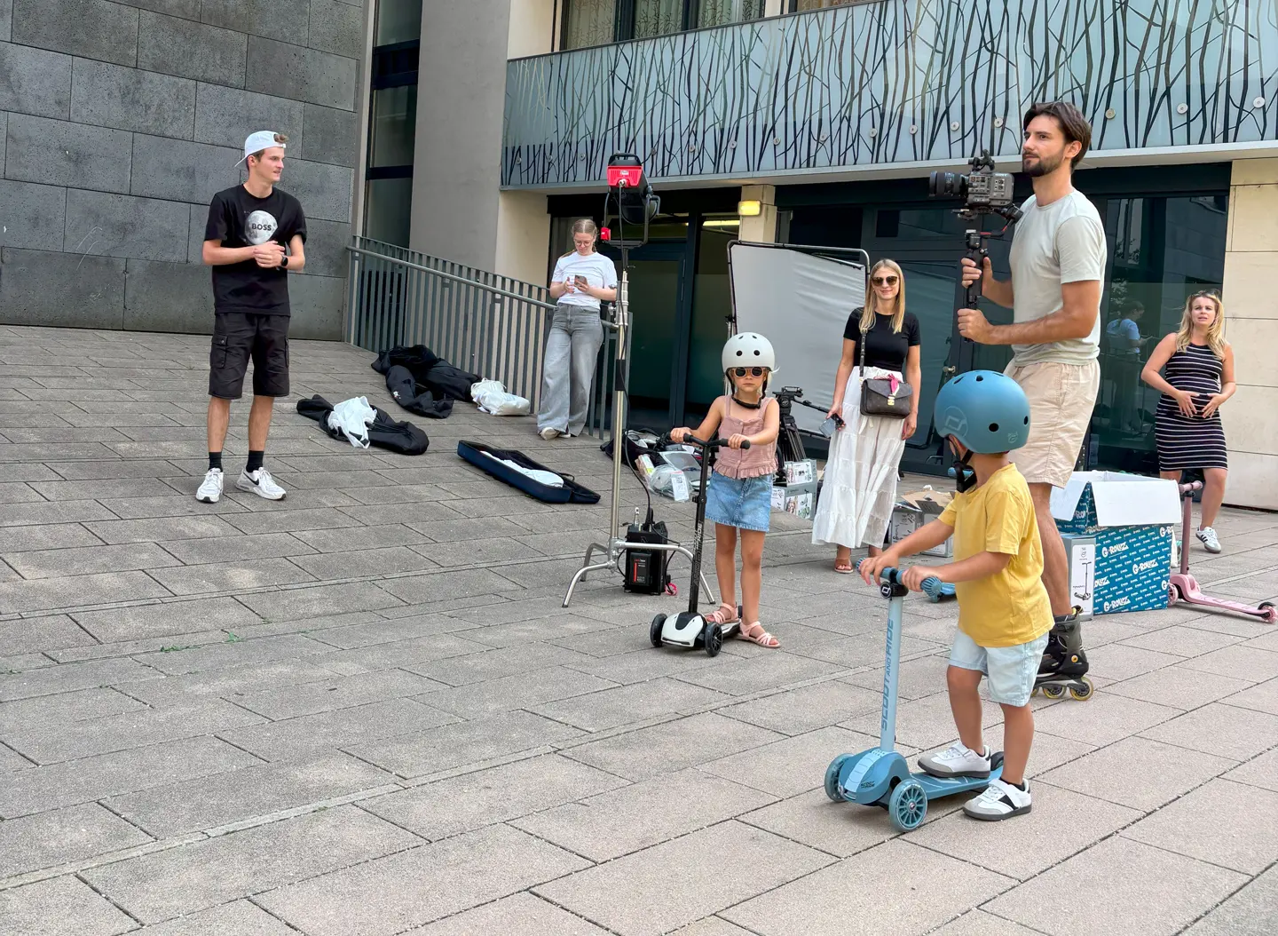 Film crew standing next to equipment